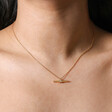 Close up of Crystal Feature T-Bar Pendant Necklace in Gold on model