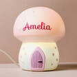 Personalised Fairy Toadstool LED Night Light Turned on, Standing on a Beige Surface