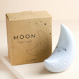 Personalised Smiling Crescent Moon LED Night Light with Box on Beige Surface