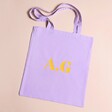 Personalised Yellow Initials Tote Bag against beige coloured backdrop