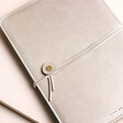 Close up of closure on Personalised Birth Flower Vegan Leather Refillable Notebook in grey