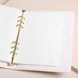 Personalised Birth Flower Vegan Leather Refillable Notebook open showing inside pages against beige backdrop