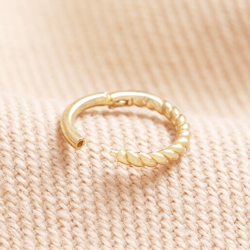 Tish Lyon Solid Gold Rope Tiny Hoop Earring open showing closure on natural coloured fabric