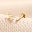 Tish Lyon Triple Champagne Crystal Solid Gold Helix Earring on top of beige coloured material