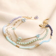 Big Metal London Set of 3 Blue Beaded Anklets in Gold on Beige Fabric