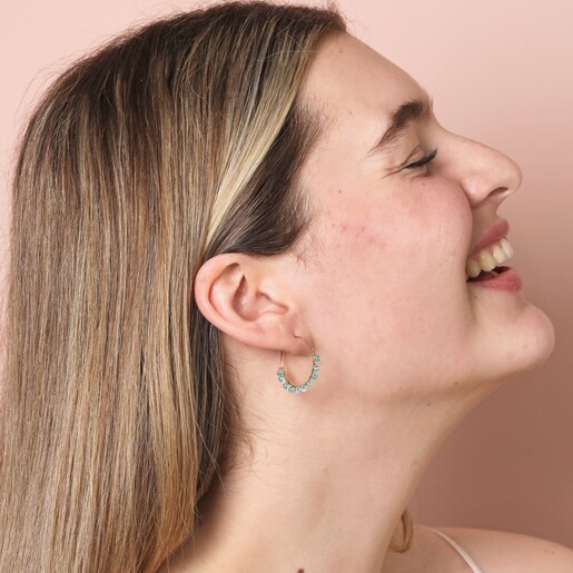 Big Metal London Medium Blue Beaded Hoop Earrings in Gold on model with head leant backwards