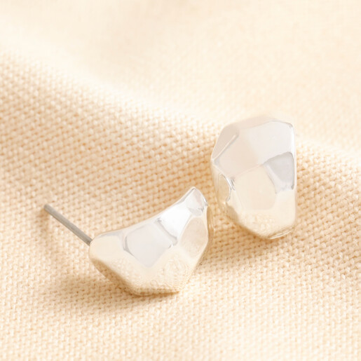 Big Metal London Hammered Half Hoop Earrings in Silver on top of beige coloured fabric