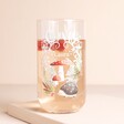Personalised Woodland Highball Glass with liquid inside against beige backdrop