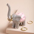 Ellie the Elephant Ring Holder with rings on trunk against beige backdrop