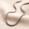 Men's Sterling Silver Foxtail Chain Necklace on top of neutral coloured fabric