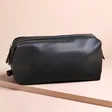 Men's Vegan Leather Wash Bag in Black on Beige Surface