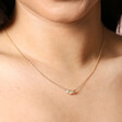 Close Up of Model Wearing Estella Bartlett Pearl and Scallop Pendant Necklace in Gold 