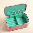 Estella Bartlett Mini Jewellery Box in Pink open showing turquoise lined interior