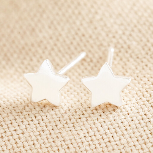 Sterling Silver Puffed Star Stud Earrings on top of beige coloured fabric