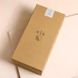 Elä Life Begin No. 1 Pom Pom Flower Diffuser on top of beige coloured backdrop