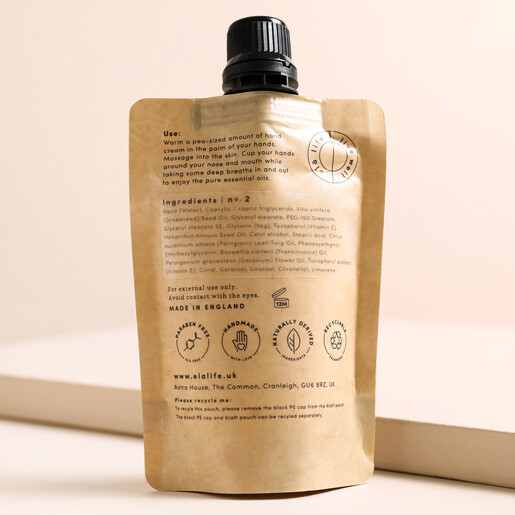 Back of Elä Life Nurture No. 2 Vitamin E Hand Cream showing ingredients on beige backdrop