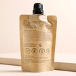 Back of Elä Life Rest No. 5 Vitamin E Hand Cream packaging against beige backdrop