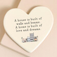 Home is Built of Love and Dreams Ceramic Heart Coaster in cream on top of neutral backdrop