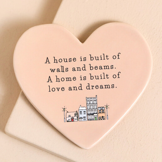 Pink Coaster Home is Built of Love and Dreams Ceramic Heart Coaster in pink against beige backdrop