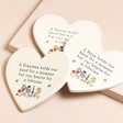 Grandmother Cream Ceramic Heart Coasters in all three options together on beige surface