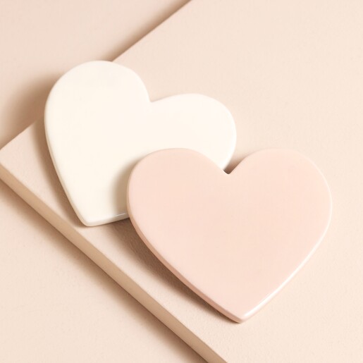 Pink and Cream Heart Coasters stacked on top of beige surface