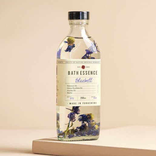 Fikkerts Fruits of Nature Bluebell Bath Essence on top of raised beige surface