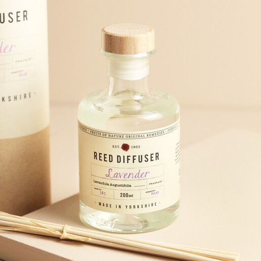 Close up of bottle from Fikkerts Fruits of Nature Lavender Reed Diffuser outside of packaging