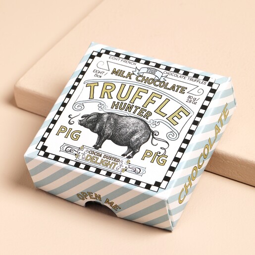 The Truffle Hunter Cocoa Dusted Milk Chocolate Truffles with lid on against beige coloured  background