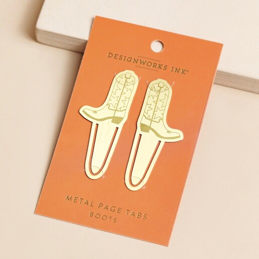 Designworks Ink Set of 2 Cowboy Boot Metal Bookmarks on Packaging Card on Pink Surface