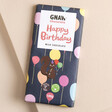 Gnaw Happy Birthday Milk Chocolate on Pink surface