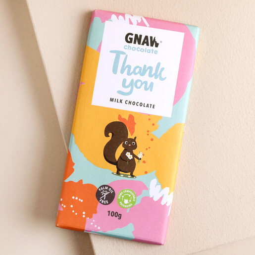 Gnaw Thank You Milk Chocolate on Pink Surface