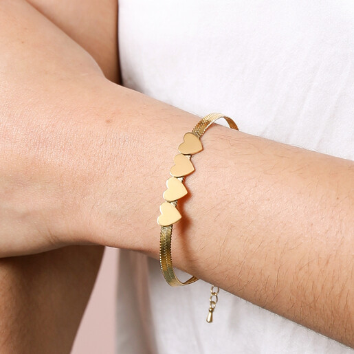 Bracelet on Model Model Wearing Gold Stainless Steel Four Heart Charm Herringbone Bracelet