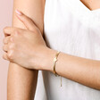 Gold Stainless Steel Heart Charm Herringbone Bracelet on Model