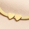 Close Up of Double Hearts on Gold Stainless Steel Two Heart Charm Herringbone Bracelet