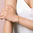Gold Stainless Steel Two Heart Charm Herringbone Bracelet on Model