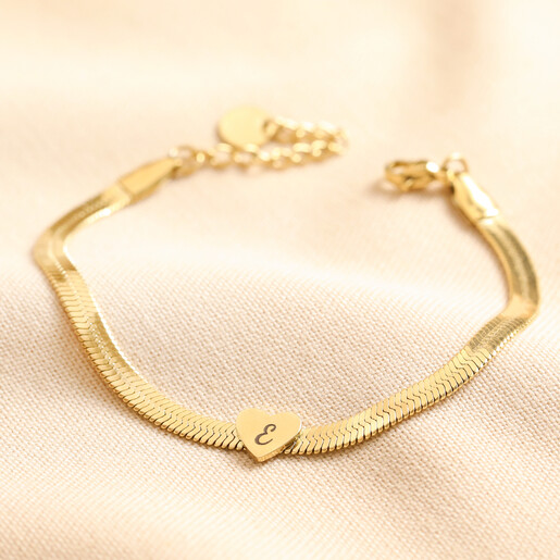 Personalised Gold Stainless Steel Heart Charm Herringbone Bracelet with one heart charm on Beige Fabric