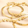 Personalised Gold Stainless Steel Heart Charm Herringbone Bracelet on Beige Fabric