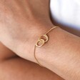 Personalised Interlocking Matte Circles Bracelet in gold on model