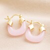 Pink Resin Huggie Hoop Earrings in Gold on Beige Fabric