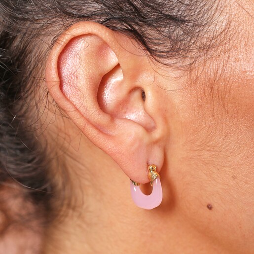 Close Up of Model Wearing Pink Resin Huggie Hoop Earrings in Gold
