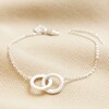 Interlocking Matte Hoops Bracelet in Silver on top of beige coloured backdrop