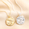 Mermaid Coin Pendant Necklace in Gold with Silver Version on Beige Fabric