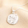 Mermaid Coin Pendant Necklace in Silver on beige fabric