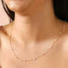 Close Up of Gold Pearl Necklace