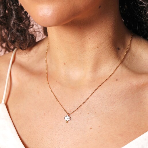Close Up of White Enamel Mushroom Pendant Necklace in Gold on Model
