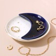Nesting Moon Trinket Dish Set against pink backdrop with jewellery inside and outside of tray