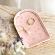 Pink Celestial Arch Trinket Dish with jewellery inside on top of wooden counter