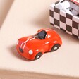 Tiny Matchbox Ceramic Racing Car Token with token out of packaging