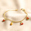 Fruit Charm Bracelet in Gold on Beige Fabric