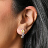 Close Up of Pastel Enamel Floral Huggie Hoop Earrings in Gold on Model